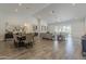 Open-concept living space with dining area, recessed lighting, and sliding glass doors to the backyard at 3834 E Clarendon Ave, Phoenix, AZ 85018