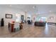 Spacious living room with vaulted ceilings, tile floors, modern lighting, and sliding glass doors at 3834 E Clarendon Ave, Phoenix, AZ 85018