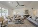 Spacious living room with contemporary design elements, plush seating, and a view into the kitchen at 3834 E Clarendon Ave, Phoenix, AZ 85018