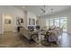 Stylish living room featuring a fireplace, contemporary art, and plush seating, creating a cozy atmosphere at 3834 E Clarendon Ave, Phoenix, AZ 85018