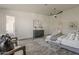 Bright main bedroom featuring a ceiling fan, modern art and decor, light walls, and wood-look floors at 3834 E Clarendon Ave, Phoenix, AZ 85018