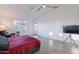 Bright and airy main bedroom with vaulted ceiling, tiled floors, and a comfortable seating area at 3834 E Clarendon Ave, Phoenix, AZ 85018