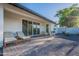 Patio and back of house with sliding glass doors and outdoor lounge furniture at 3834 E Clarendon Ave, Phoenix, AZ 85018