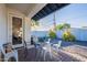 Covered patio with seating area, overlooking a landscaped backyard with privacy fence at 3834 E Clarendon Ave, Phoenix, AZ 85018