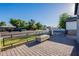 View of a well maintained fenced property from the corner of a brick-paved patio at 3834 E Clarendon Ave, Phoenix, AZ 85018