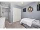 Cozy bedroom featuring plush carpeting, ceiling fan, and closet at 4117 E Baylor Ln, Gilbert, AZ 85296