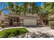 Two-story home with a two-car garage, landscaped front yard with decorative stone and a covered front porch at 4117 E Baylor Ln, Gilbert, AZ 85296