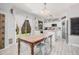 Bright kitchen and dining area with white cabinets, stainless steel appliances, and access to backyard at 4117 E Baylor Ln, Gilbert, AZ 85296