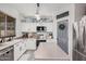 Bright kitchen featuring stainless steel appliances, countertops and island, and natural light at 4117 E Baylor Ln, Gilbert, AZ 85296