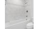 Bathroom with white marble and tile, and white tub at 4200 N Miller Rd # 112, Scottsdale, AZ 85251
