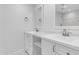 Bathroom featuring dual sinks with white cabinets and marble countertops at 4200 N Miller Rd # 112, Scottsdale, AZ 85251