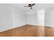 Bedroom offers wood floors, neutral walls, and ceiling fan at 4200 N Miller Rd # 112, Scottsdale, AZ 85251