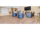 Clubhouse area with kitchenette, large TV, and comfortable seating for residents to socialize and relax at 4200 N Miller Rd # 112, Scottsdale, AZ 85251