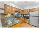 Well-lit kitchen with stainless steel appliances, wooden cabinets, and mosaic backsplash at 4200 N Miller Rd # 112, Scottsdale, AZ 85251