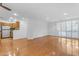 Open-concept living space features hardwood floors and leads into a modern kitchen at 4200 N Miller Rd # 112, Scottsdale, AZ 85251
