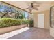 Outdoor patio with tile flooring, ceiling fan, and landscaped garden at 4200 N Miller Rd # 112, Scottsdale, AZ 85251