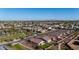 Aerial view of a well maintained neighborhood with desert landscaping and mature trees at 4352 N 91St Gln, Phoenix, AZ 85037