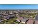 Beautiful aerial view of neighborhood with lush green park, playground, and desert landscaping at 4352 N 91St Gln, Phoenix, AZ 85037