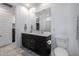 Bathroom featuring a double sink vanity with dark wood cabinets and white quartz countertops at 4352 N 91St Gln, Phoenix, AZ 85037