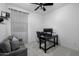 Relaxing bedroom with a sofa, desk, and a ceiling fan at 4352 N 91St Gln, Phoenix, AZ 85037