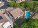 Aerial view featuring backyard pool, well-maintained lawn, desert landscape and outdoor patio area at 4466 S Brice --, Mesa, AZ 85212