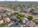Wide aerial view of residential neighborhood showcasing houses, landscaping and desert scenery at 4466 S Brice --, Mesa, AZ 85212
