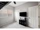 Well-lit bedroom with closet and modern entertainment center, ideal for relaxation and entertainment at 4466 S Brice --, Mesa, AZ 85212