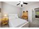 Comfortable bedroom with ceiling fan, carpet flooring, and natural light creating a relaxing atmosphere at 4466 S Brice --, Mesa, AZ 85212