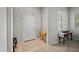 Bright foyer featuring neutral paint and trim, tile flooring, and well-placed tables for added decor at 4466 S Brice --, Mesa, AZ 85212