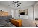 Spacious living room featuring built-in shelving, neutral paint, plush carpet, and ample seating at 4466 S Brice --, Mesa, AZ 85212