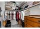 Walk-in closet with lots of hanging clothes and shelves for storage at 4466 S Brice --, Mesa, AZ 85212