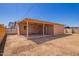 Backyard featuring a covered patio with dirt and a partial fence at 4545 N 49Th Ave, Phoenix, AZ 85031
