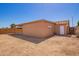 Exterior view of the brick home showcasing the backyard and covered patio at 4545 N 49Th Ave, Phoenix, AZ 85031