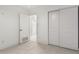 Cozy bedroom featuring a sliding door closet and tiled flooring at 4545 N 49Th Ave, Phoenix, AZ 85031