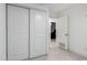 Bright bedroom with sliding door closet and neutral tiled floor at 4545 N 49Th Ave, Phoenix, AZ 85031