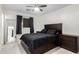 Bedroom featuring a dark wood bed frame, tile floors, and a sliding mirrored closet at 4545 N 49Th Ave, Phoenix, AZ 85031