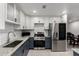 Modern kitchen showcasing granite countertops, stainless steel appliances, and a subway tile backsplash at 4545 N 49Th Ave, Phoenix, AZ 85031
