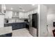 Stylish kitchen with modern appliances, white cabinets, and granite countertops at 4545 N 49Th Ave, Phoenix, AZ 85031