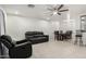 Bright living room featuring modern furniture, a ceiling fan, and tile flooring at 4545 N 49Th Ave, Phoenix, AZ 85031