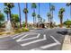 Community entrance with fountain, mature trees, and landscaping, making it a tranquil oasis to call home at 4738 N Greenview W Cir, Litchfield Park, AZ 85340