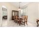 Formal dining area with a large table, seating for eight, and a built-in cabinet at 4738 N Greenview W Cir, Litchfield Park, AZ 85340
