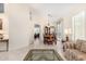 Spacious living area leads to a formal dining area featuring a large table with seating for eight at 4738 N Greenview W Cir, Litchfield Park, AZ 85340