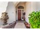 Inviting front entryway with a decorative water feature and well-maintained landscaping at 4738 N Greenview W Cir, Litchfield Park, AZ 85340