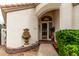 Charming home featuring a decorative water feature and inviting entryway at 4738 N Greenview W Cir, Litchfield Park, AZ 85340