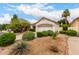 Charming house with well-maintained desert landscaping and mature trees in a friendly neighborhood at 4738 N Greenview W Cir, Litchfield Park, AZ 85340