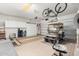 Garage with a golf cart, bike rack, and built-in storage cabinets, providing organized space for hobbies and vehicles at 4738 N Greenview W Cir, Litchfield Park, AZ 85340