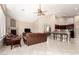 Spacious living room featuring tile floors, a fireplace, and an open floor plan at 4738 N Greenview W Cir, Litchfield Park, AZ 85340