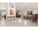 Spacious living room with tile flooring offers versatile layout and seamlessly connects to dining area at 4738 N Greenview W Cir, Litchfield Park, AZ 85340
