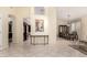 Open floor plan seamlessly connects kitchen and dining area, accented by neutral color palette and tile at 4738 N Greenview W Cir, Litchfield Park, AZ 85340