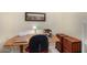 Home office with a cozy desk setup and stylish storage solutions, ideal for remote work or study at 4738 N Greenview W Cir, Litchfield Park, AZ 85340